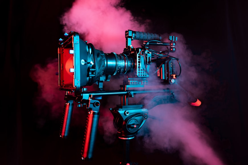 camera in pink smoke